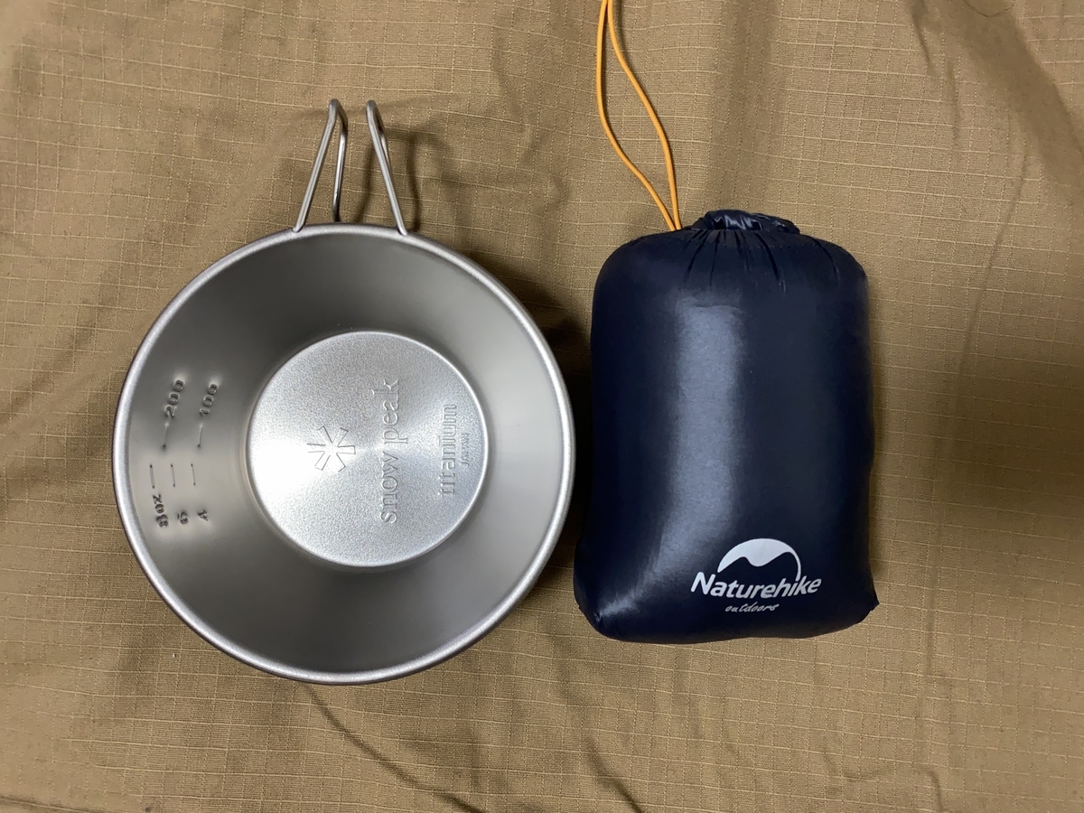 Down tent shoes and Sierra cup