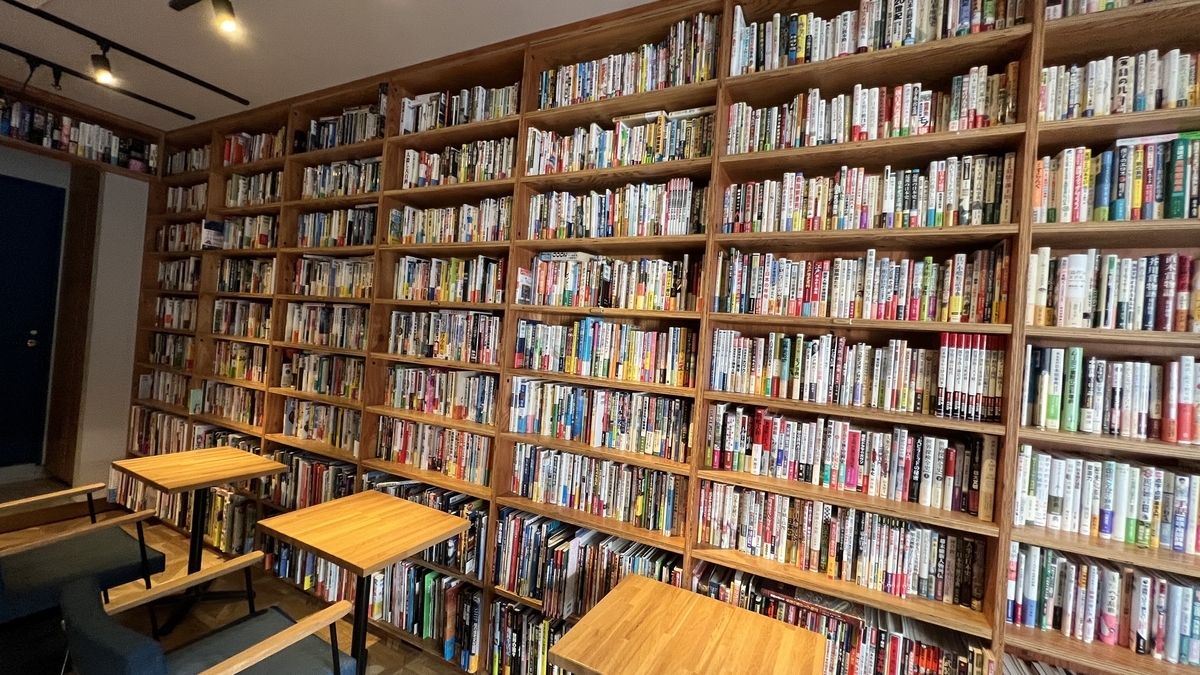 A wall of books displayed throughout the space