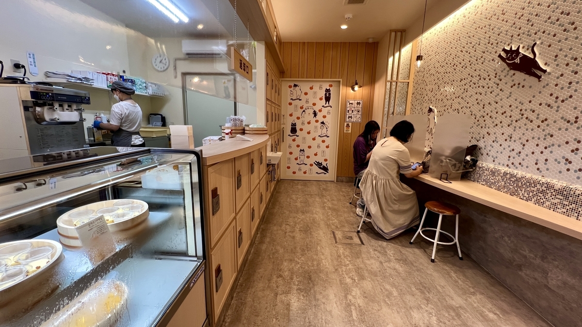 Cat illustrations decorate the eat-in area