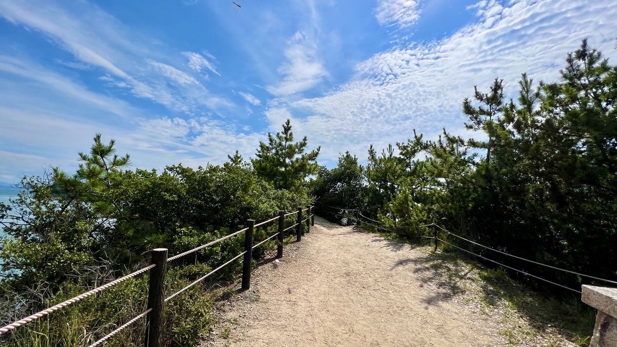 Promenade leading toward the Yakusoku-no-Oka viewpoint through natural greenery
