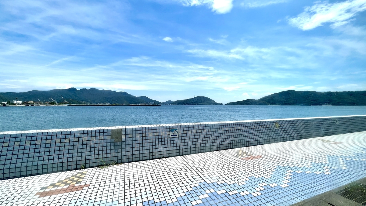 Calm Seto Inland Sea and Shodoshima coastline under a clear blue sky