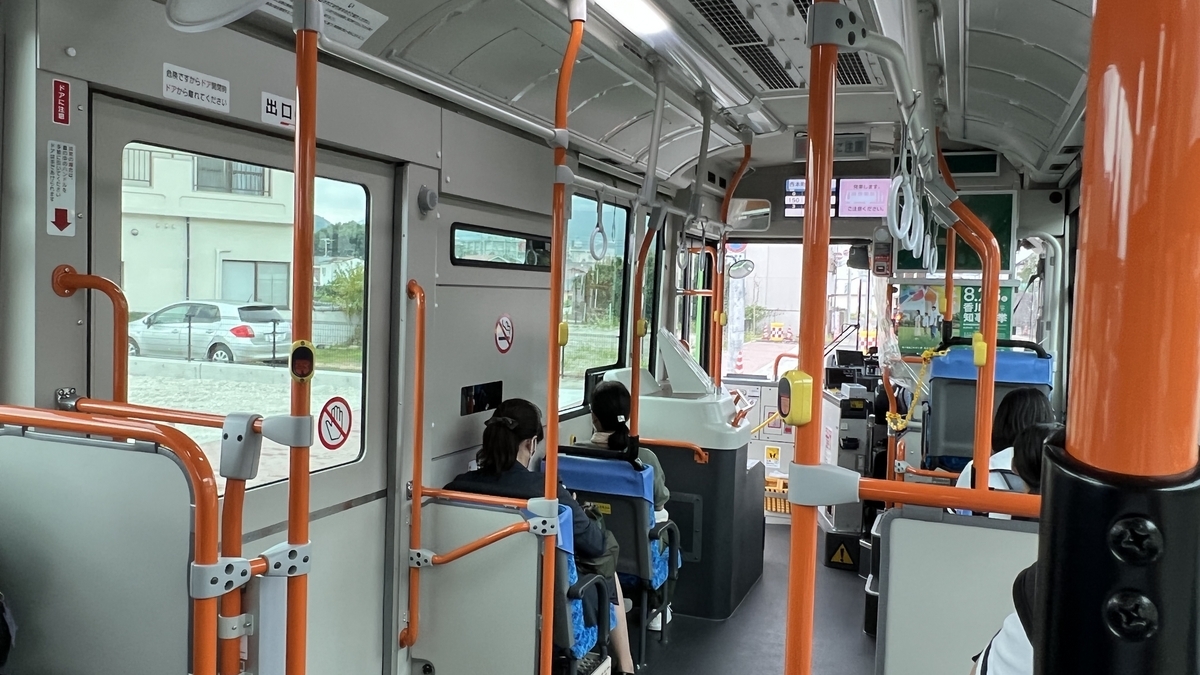 Interior of the Olive Bus showing seats and passengers.