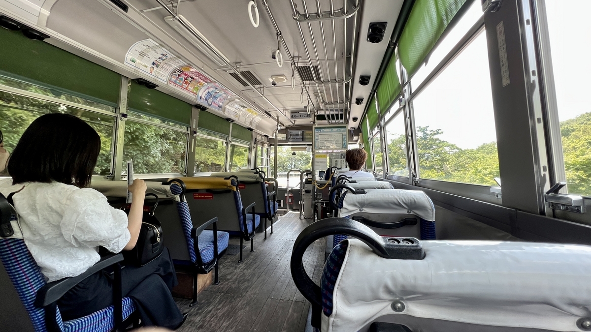 Rear seats and passengers inside the bus from Kōuntei to Kusakabe Port.