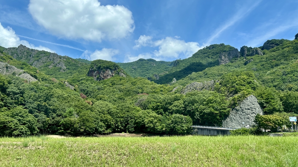 Blue sky and green mountains of Kankakei seen from the bus window.