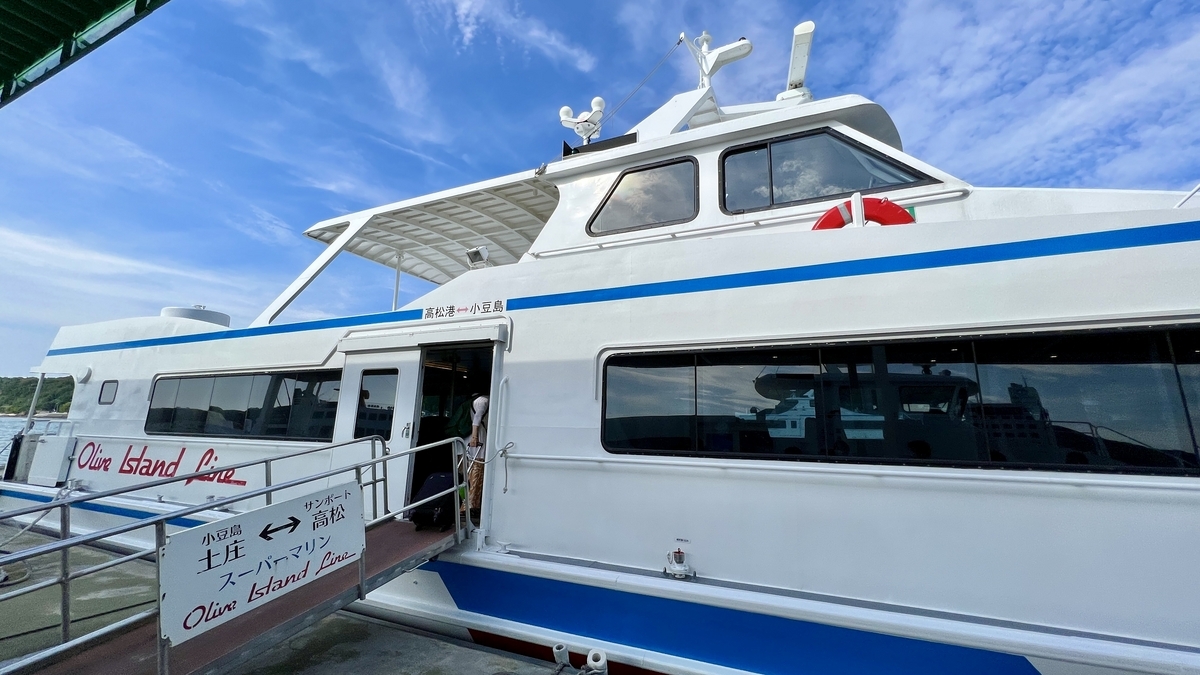 Side view of the boat with the Olive Marine logo before boarding.