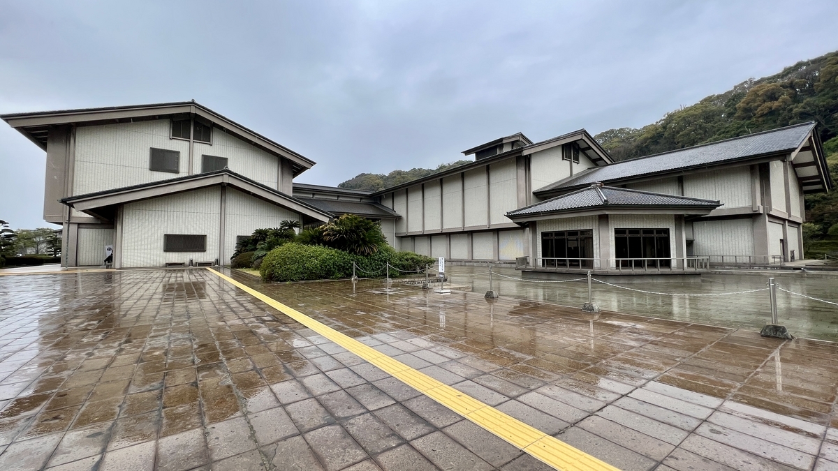 Full view of the Reimeikan Museum and its plaza after a rain shower