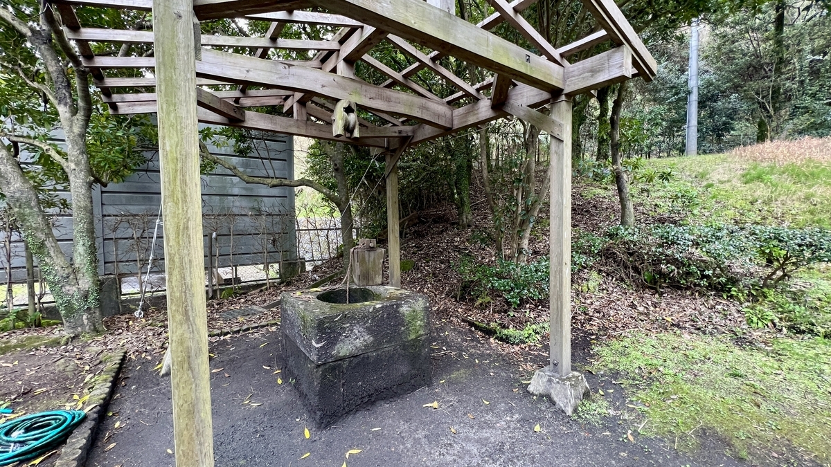 Wooden roofed well standing beside the farmhouse Tenoma Futatsuya
