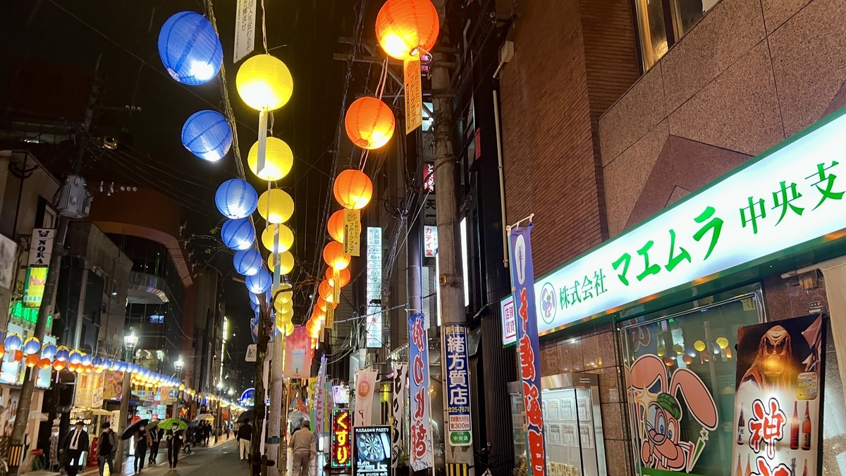 Night street in Nishitachi filled with colorful lanterns