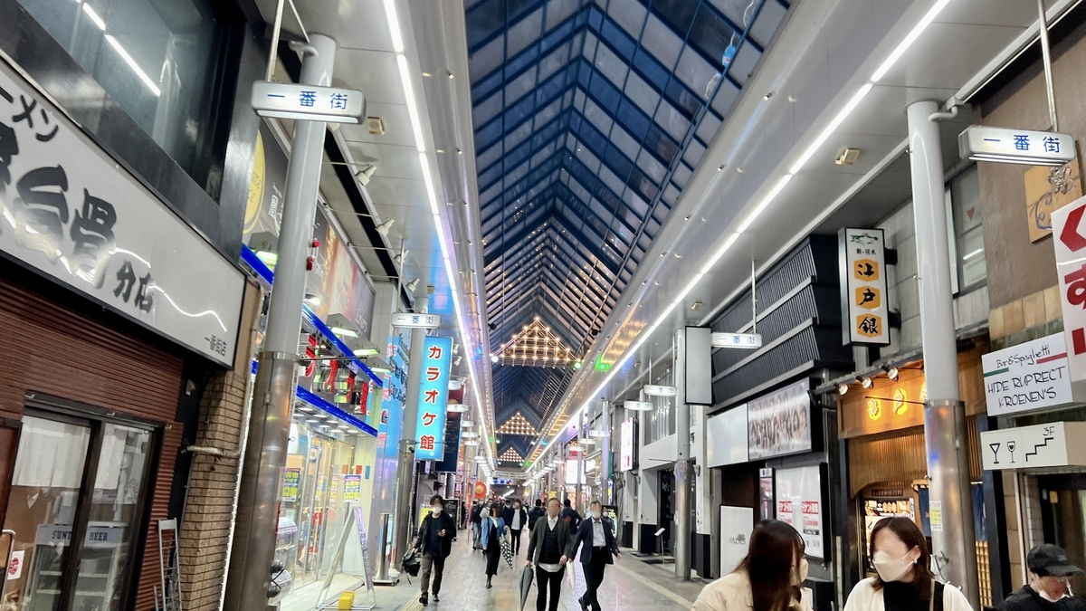 Inside Ichibangai arcade with continuous storefronts and bright ceiling lights