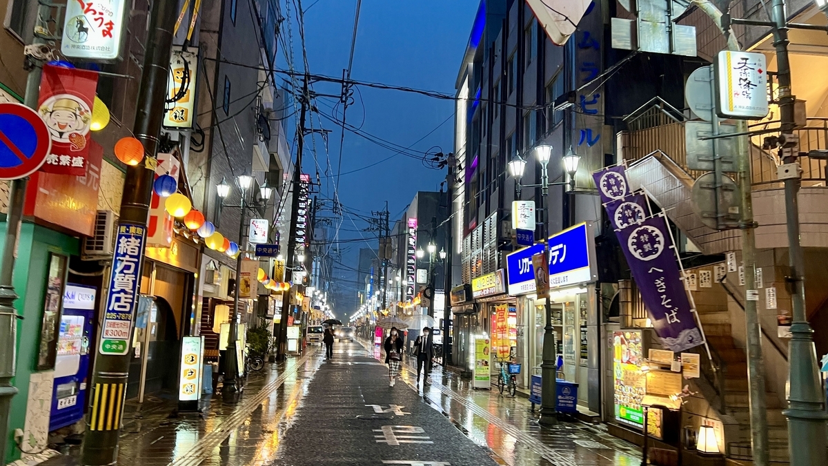 Calm night view of Nishitachi with warm lights lining the street
