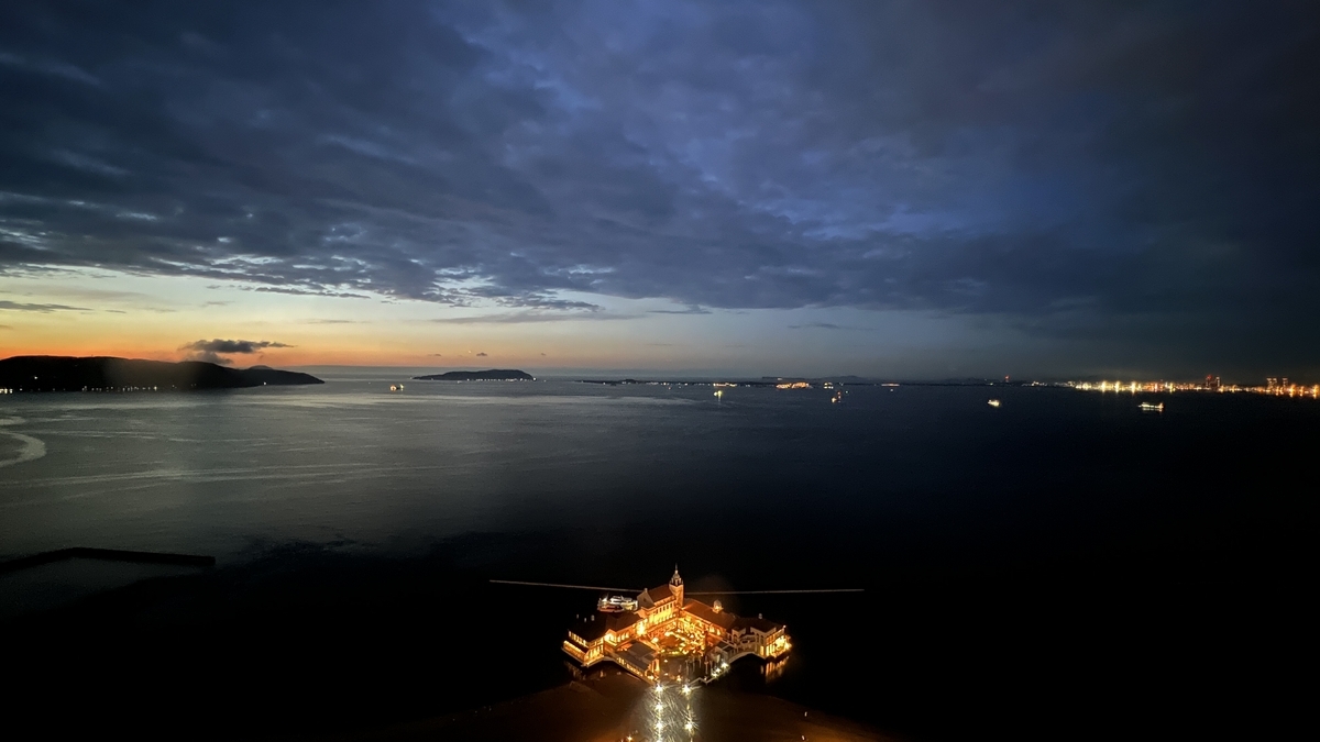 Twilight view over Hakata Bay with brightly lit Marizon buildings on the water