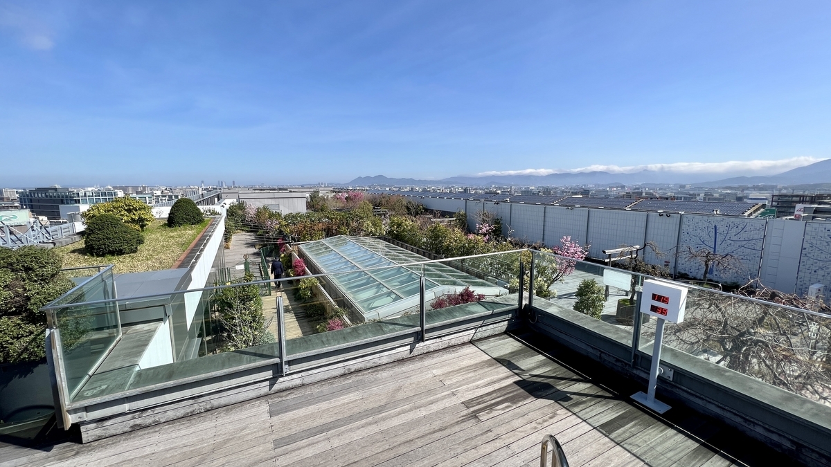 The rooftop observation deck overlooking the garden and Hakata cityscape