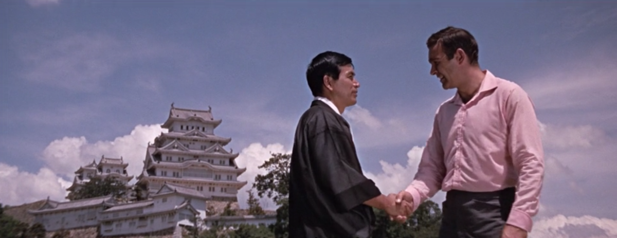 Bond (Sean Connery) landing in the San-no-maru Square and being greeted by Tiger Tanaka (Tetsuro Tanba)