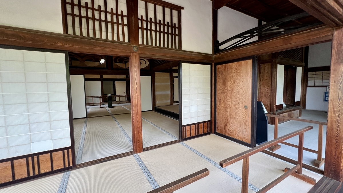 The structure includes sliding doors and railings designed to let in natural light.