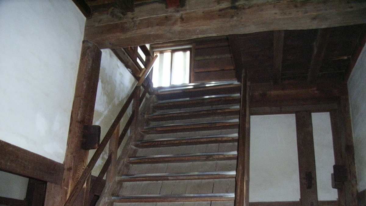Inside the Marugame Castle keep: wooden staircase and beams preserve the Edo-period architecture.
