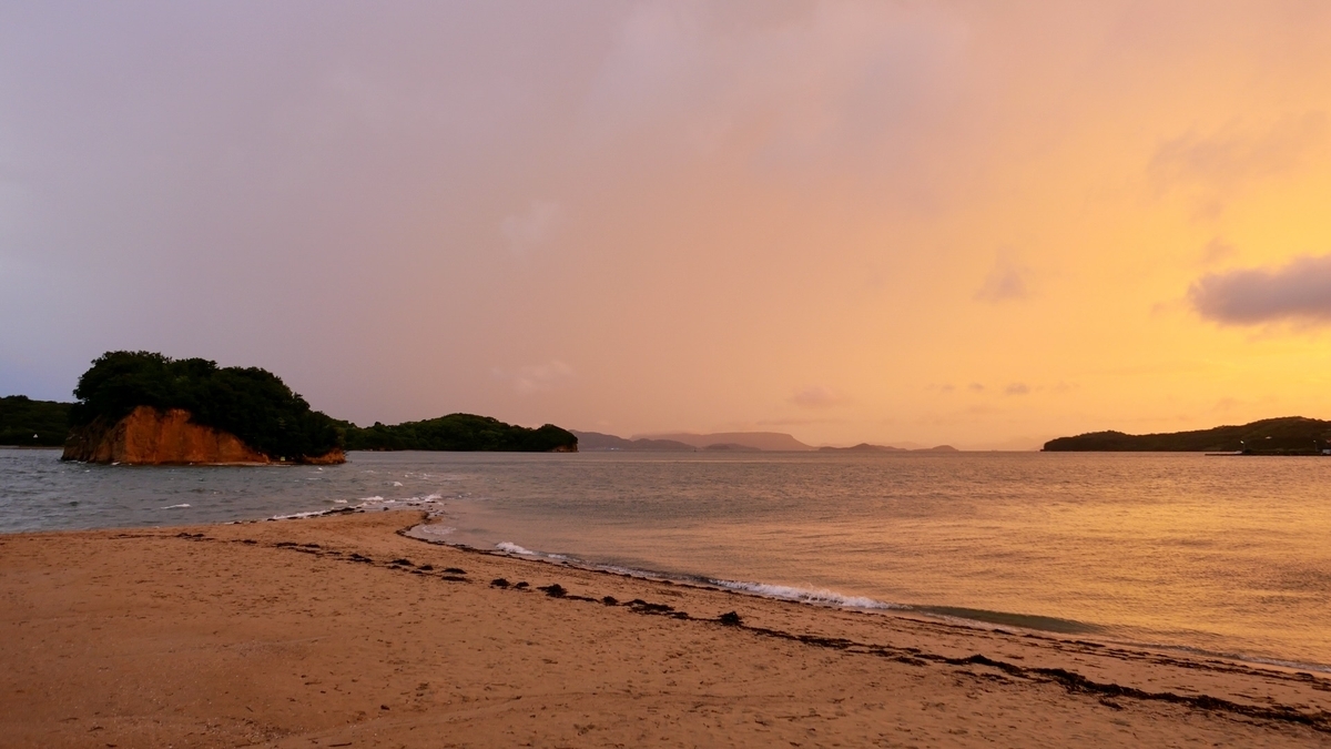 Angel Road at sunset under an orange sky and sea
