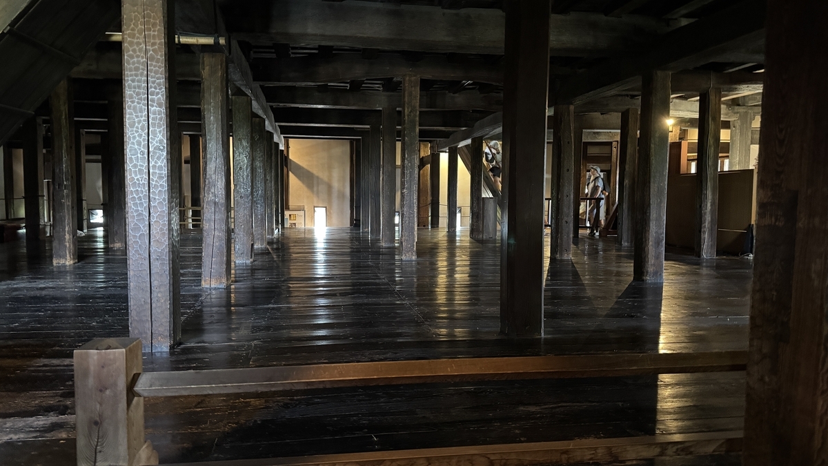 Corridor with rows of pillars on the first floor of Matsumoto Castle keep