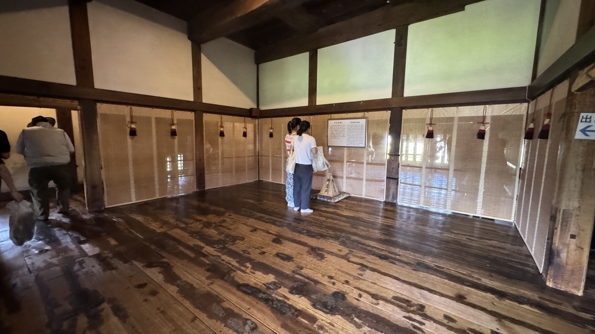Fourth floor interior with wide wooden planks lit by natural light