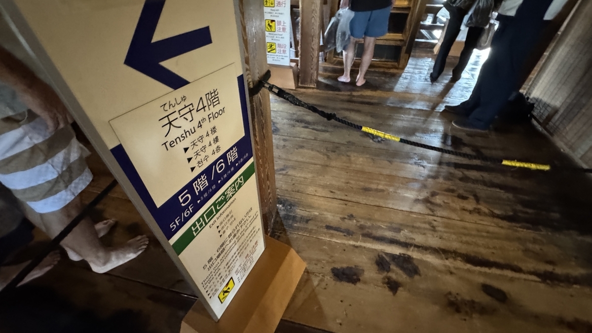 Entrance to the steep wooden staircase leading to the fifth floor