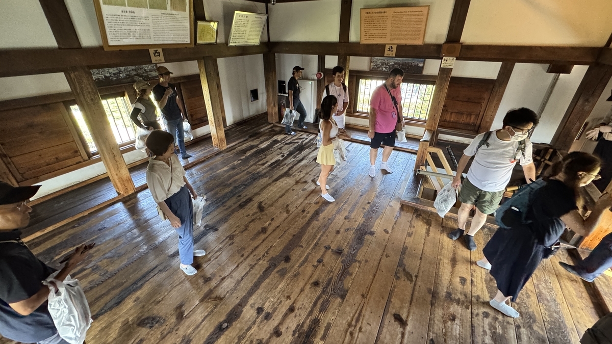 Visitors exploring the top hall on the sixth floor
