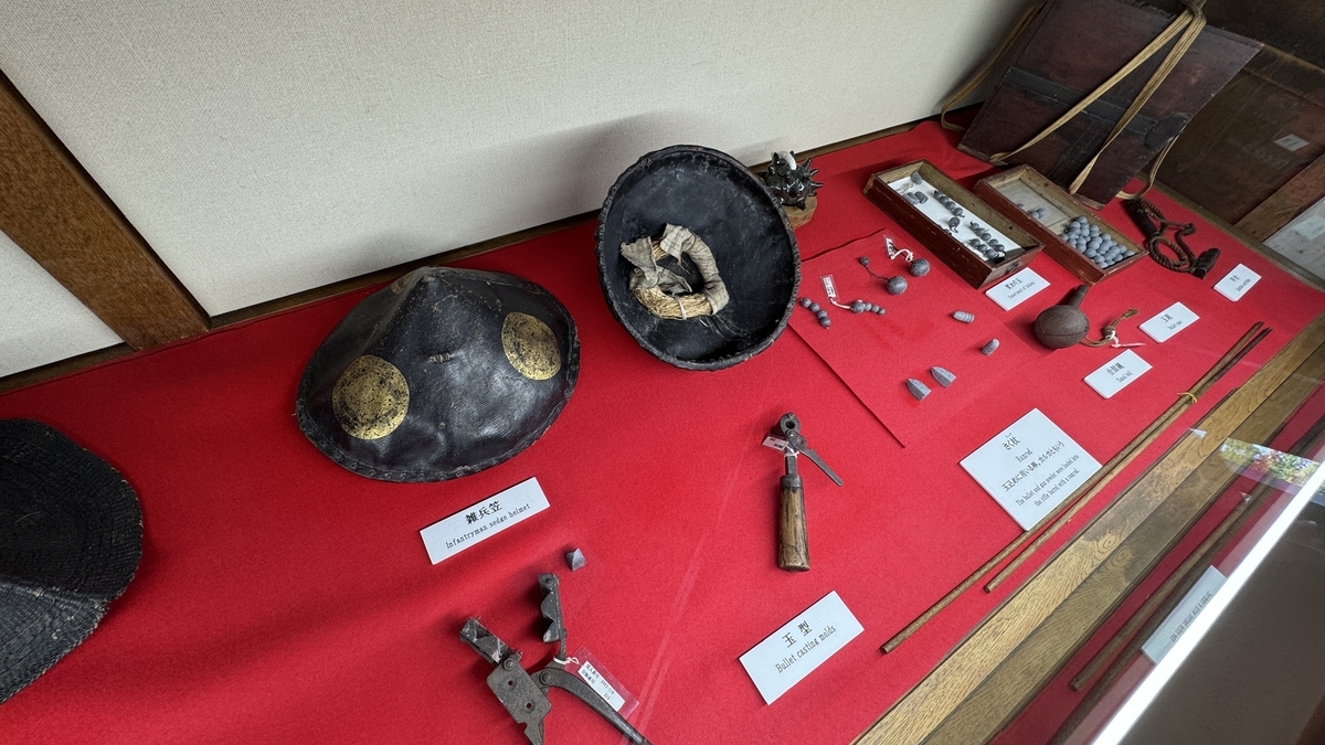 Exhibit of helmets and flint tools in Tatsumi Turret