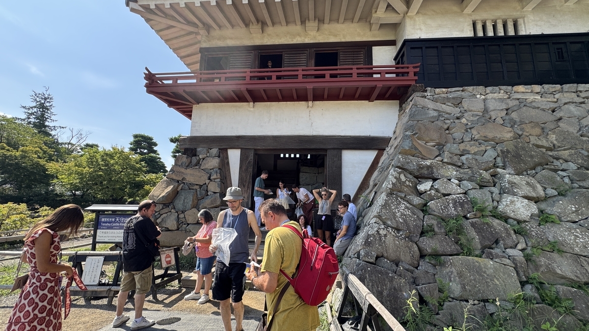 Visitors returning shoe bags at the keep exit