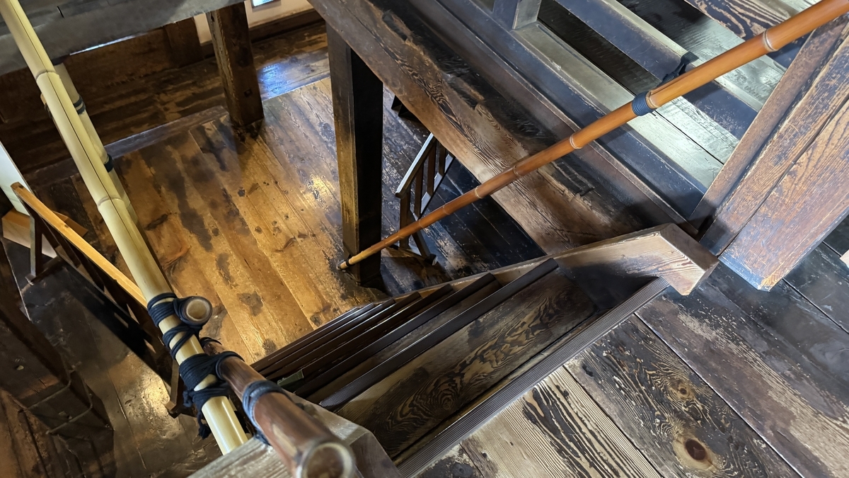 Timber framing and stairs viewed from below inside the keep