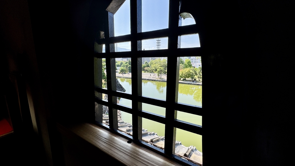 Katōmado arched window remaining in the Tatsumi Turret with outside view