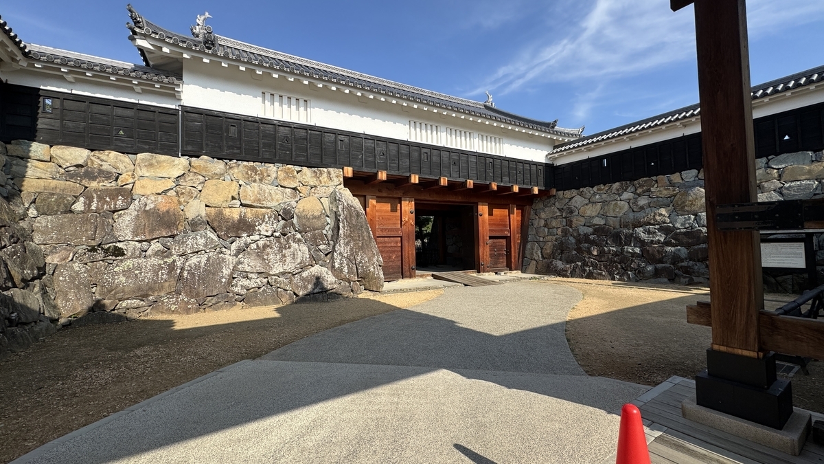 Interior space of Taiko Gate masugata surrounded by stone walls and turrets