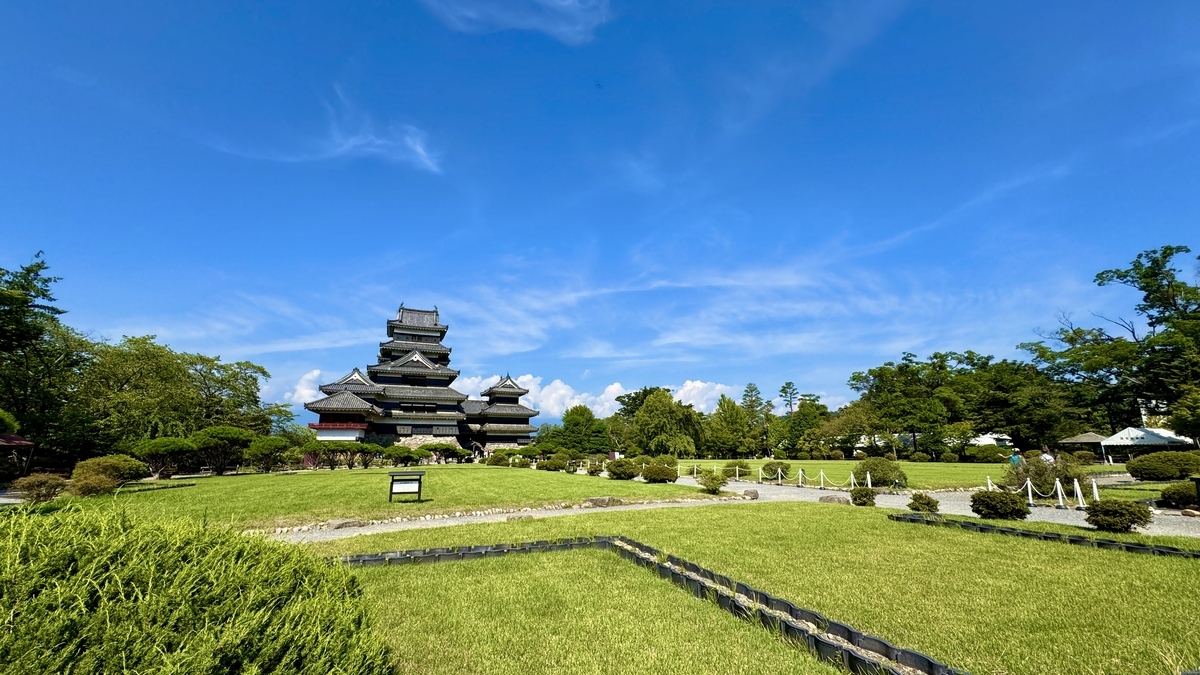 View of Matsumoto Castle’s keep seen across the lawn of Honmaru Garden