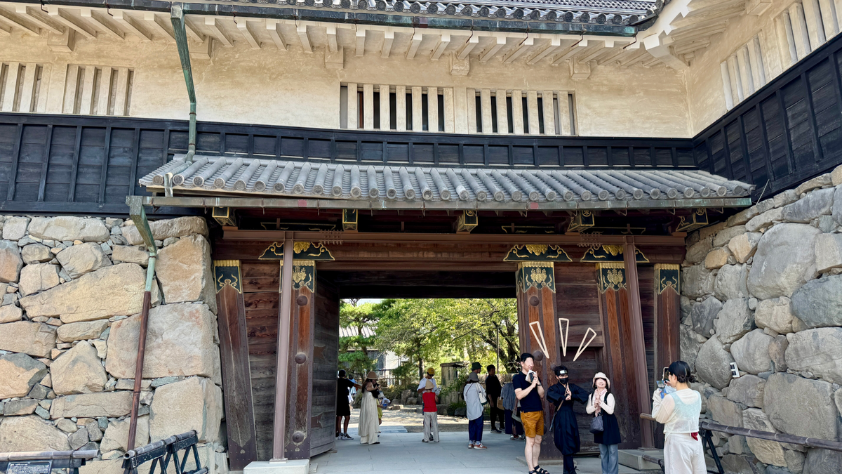 Visitors passing the main gate with samurai and ninja greeters