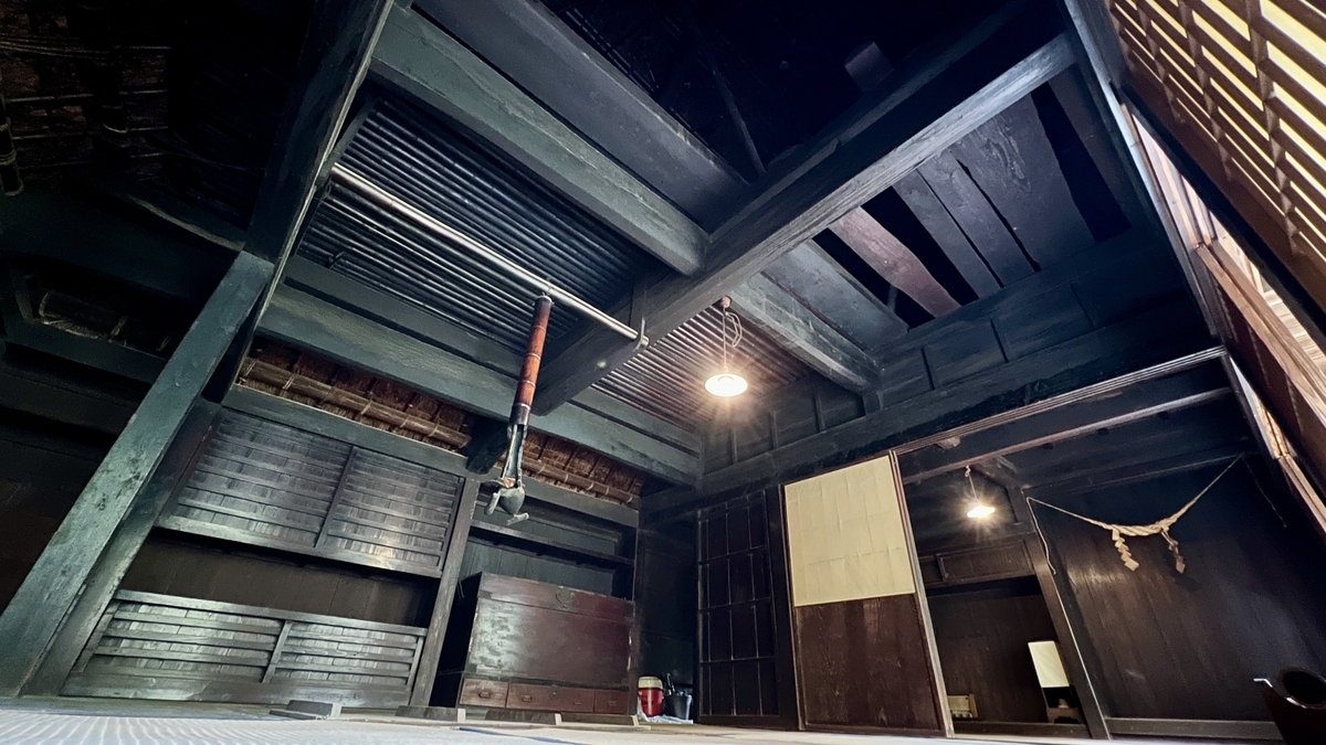 Wooden beams and ceiling structure inside the Tenoma Futatsuya house
