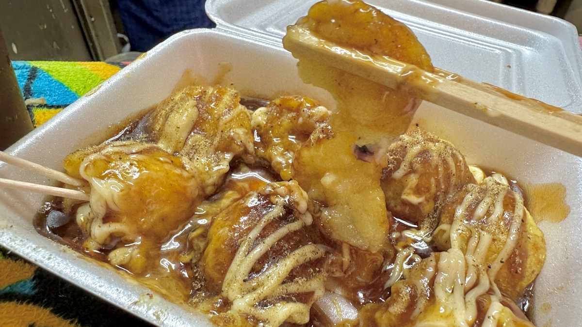 Close-up of takoyaki highlighting the balance of batter sweetness and sauce