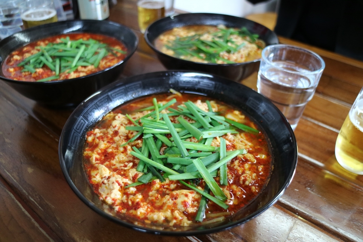 Bowl of Karamen with red soup and Chinese chives
