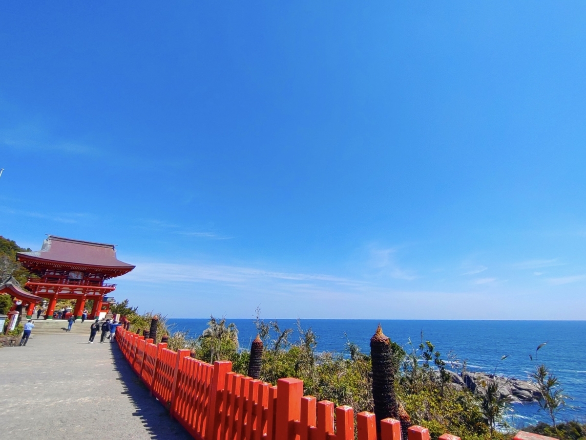 Romon gate of Udo Jingu Shrine and approach with views of the blue sea