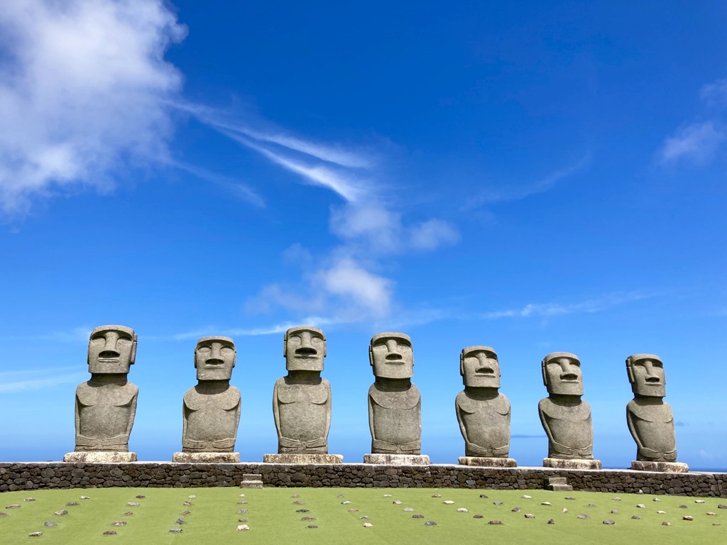 Stone Moai statues against blue sky at Sun Messe Nichinan
