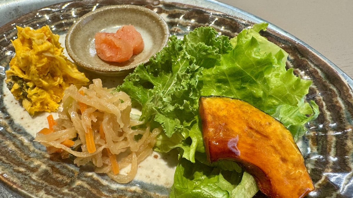 A side plate with kabocha, mentaiko, and seasonal vegetables