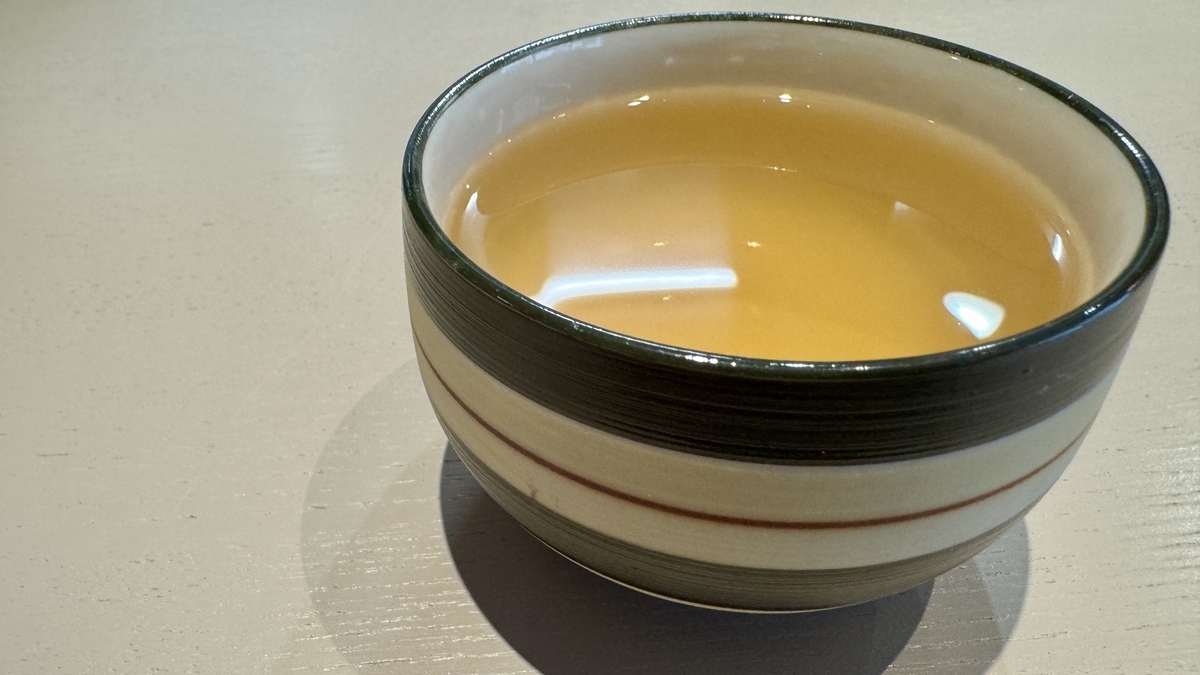 A cup of warm tea served after the meal