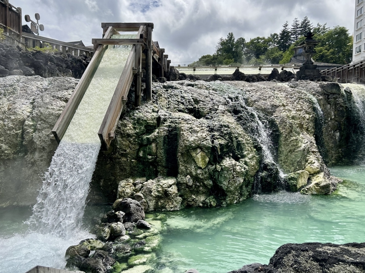 Cloudy white water flowing through the yubatake of Kusatsu Onsen