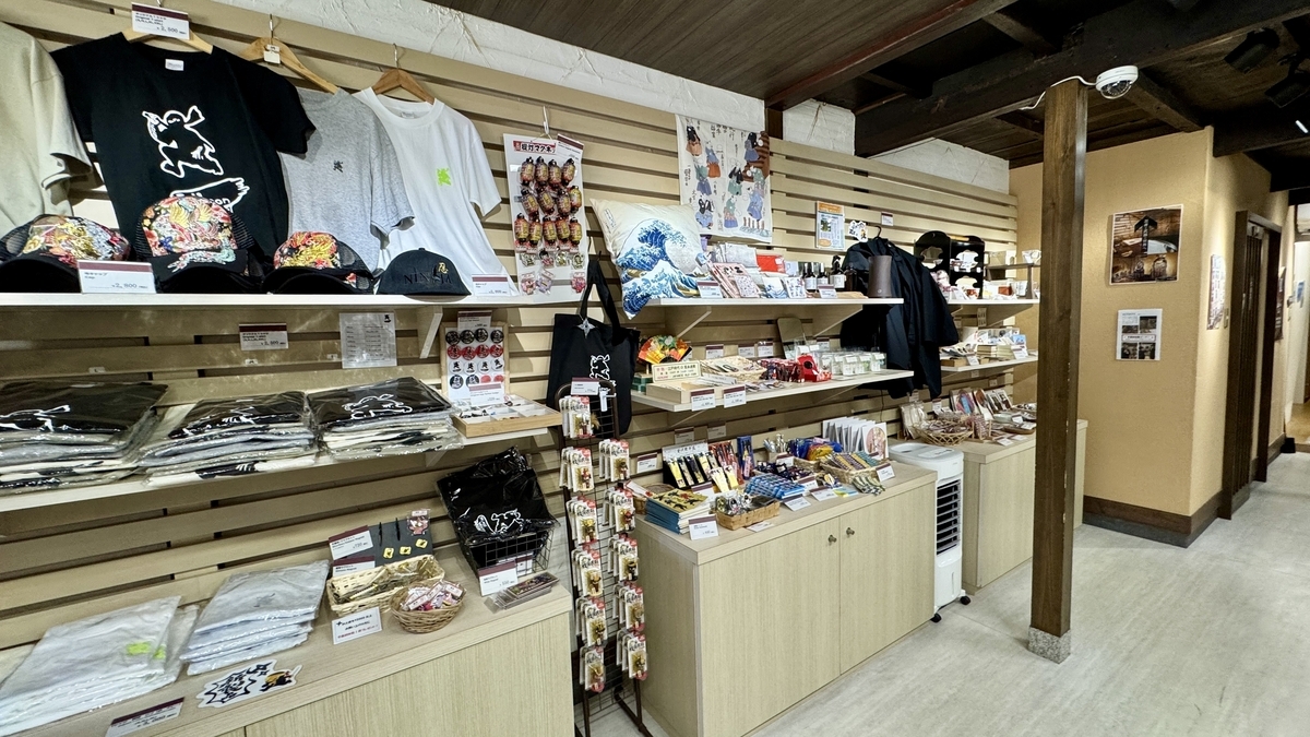 Sales shelves of ninja goods lined with T-shirts and small items