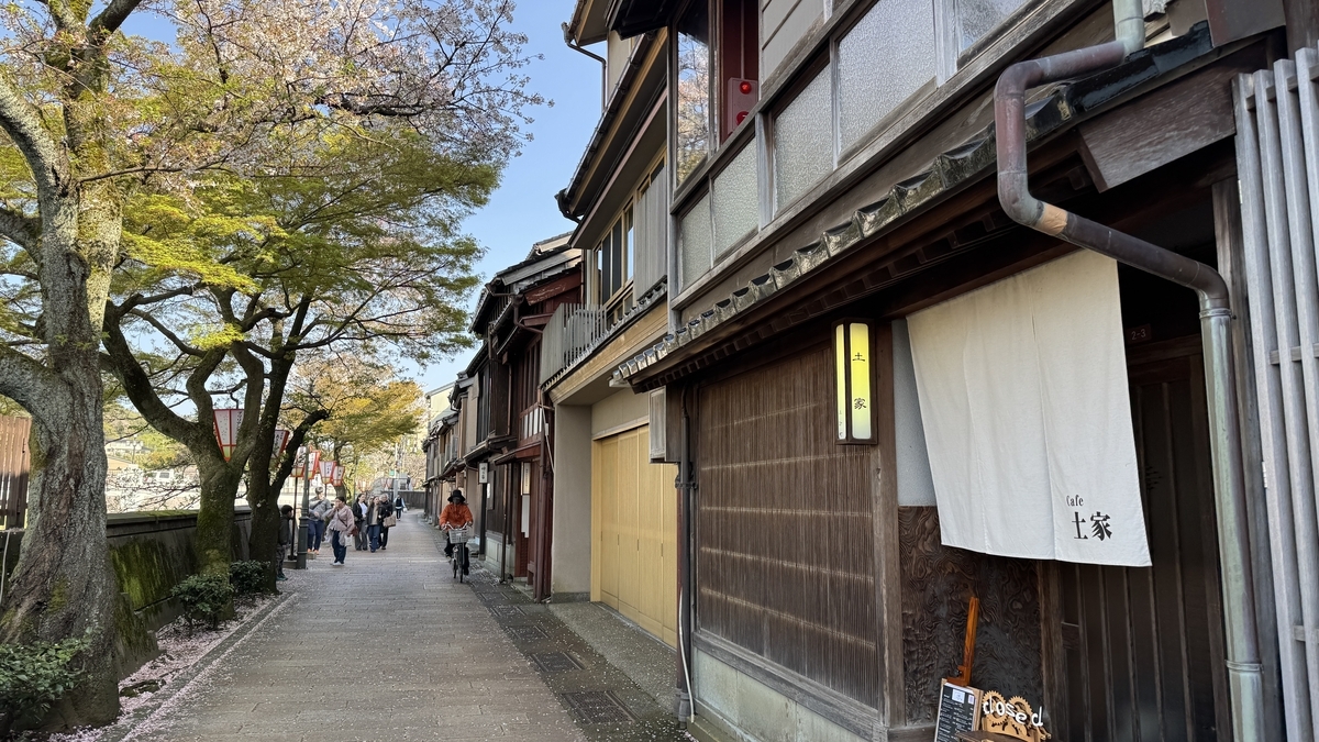 The noren of Machiya Cafe Tsuchiya and the riverside townscape of Kazuemachi Chaya District